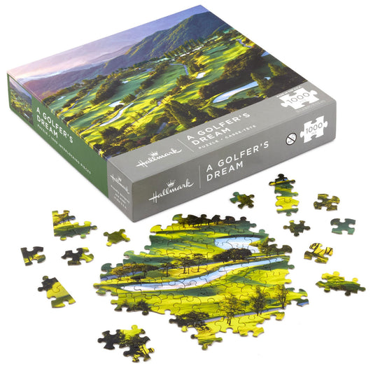 A Golfer's Dream, 1,000-Piece jigsaw puzzle box with pieces scattered, showcasing vibrant golfing landscape.