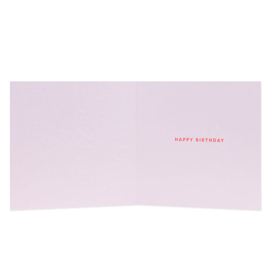 Hallmark Floral Birthday Card inside view with embossed design and bright red 'Happy Birthday' text on pale pink background.