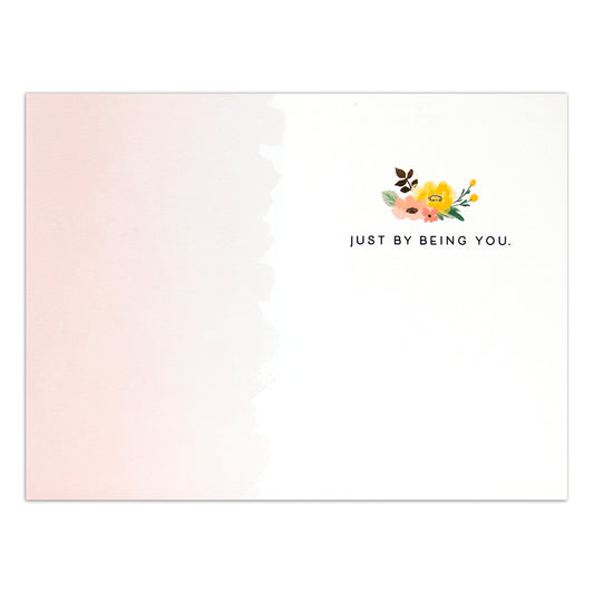 Hallmark Signature Greeting Card - You Make The World Better featuring a pastel pink design, floral illustrations, and the message 'Just by being you.'