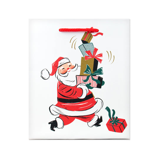 Hallmark Small Gift Bag - Santa & Gifts with a retro design, featuring Santa carrying stacked presents and a red cord handle.