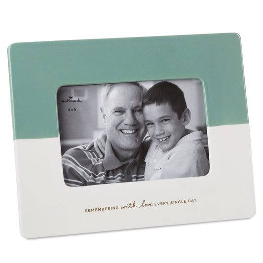 Remembering With Love Picture Frame, 4x6, ceramic, sage green and ivory, displaying a black-and-white photo of two smiling family members.