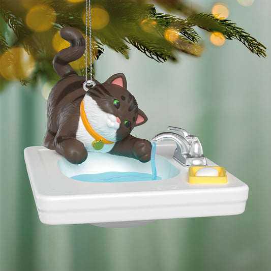 Mischievous Kittens, 28th in the Series — 2026 Hallmark Keepsake Christmas Ornament featuring a playful striped cat by a sink with running water.