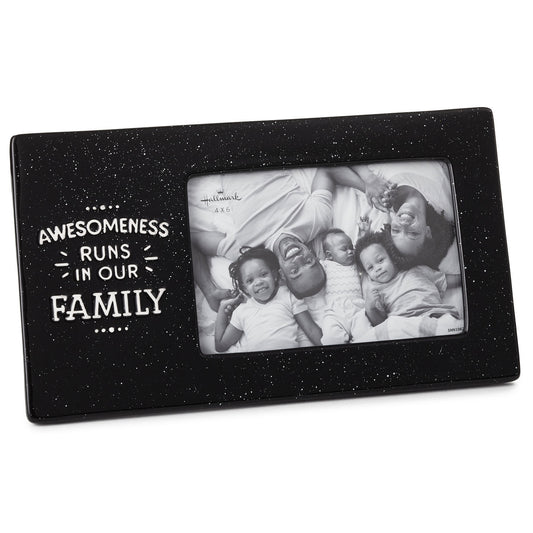 Awesomeness Runs in Our Family Ceramic Picture Frame, 4x6 with a black speckled finish and a horizontal photo opening.
