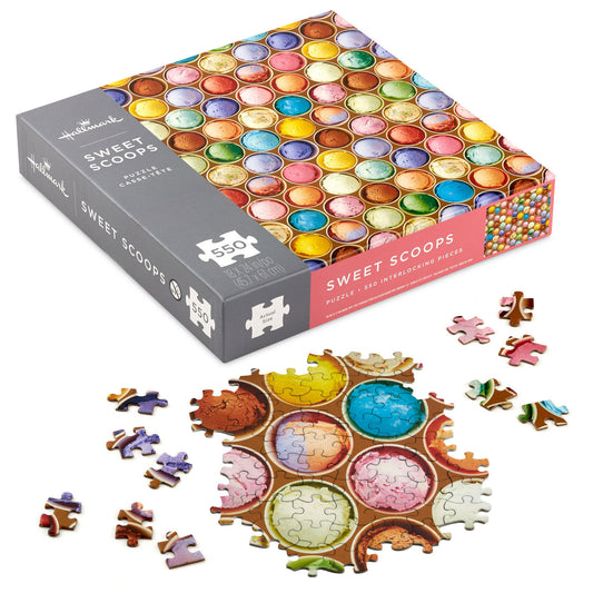 Hallmark "Sweet Scoops" 550-piece puzzle with colorful ice cream scoops, pieces displayed next to the box on a white background.