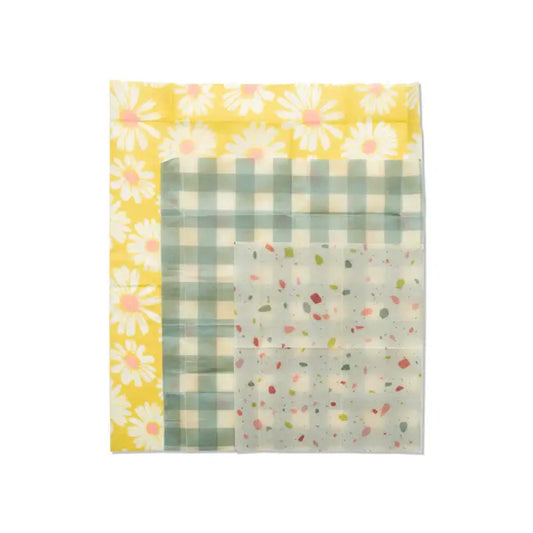 Beeswax wrap set of 3-Retro featuring floral, check, and abstract patterns in a flat lay display.