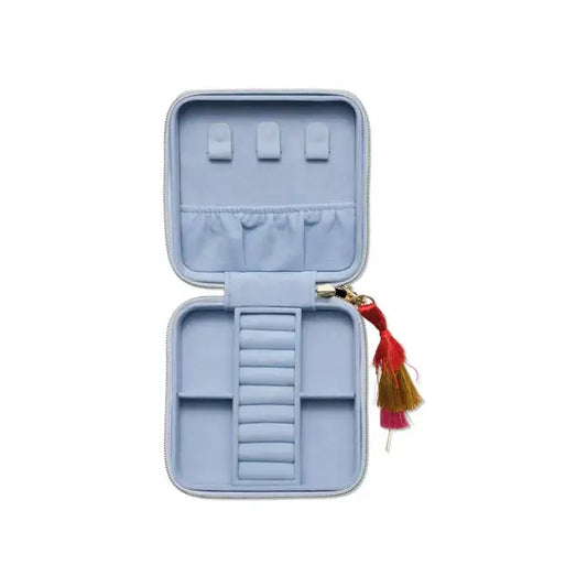 Jewelry case - Treasure Me in soft blue vegan leather, open view showcasing multiple compartments and colorful tassel detail.