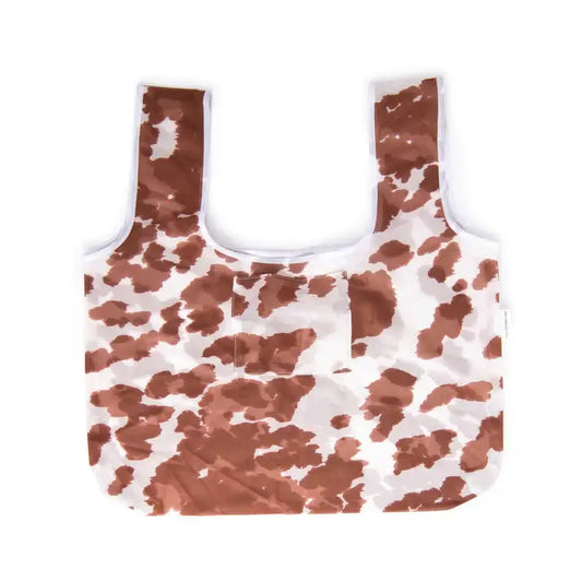 Market Bag - Moo, eco-friendly reusable shopping bag, cow print design, flat lay view, includes stitched-in pocket