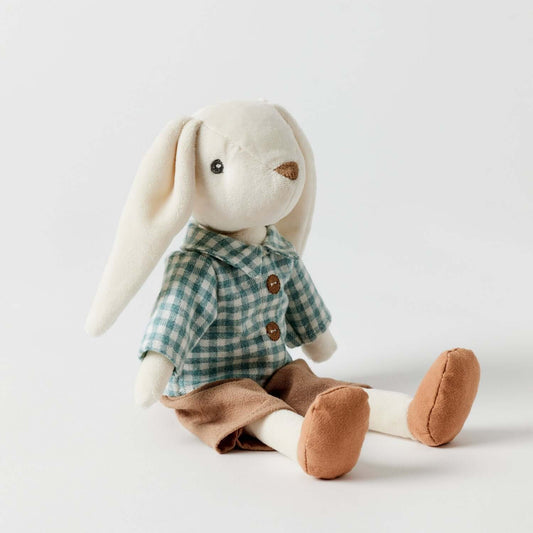 Huey the Bunny soft toy with a blue check shirt and brown pants, featuring floppy ears and a cute stitched face, angled view.