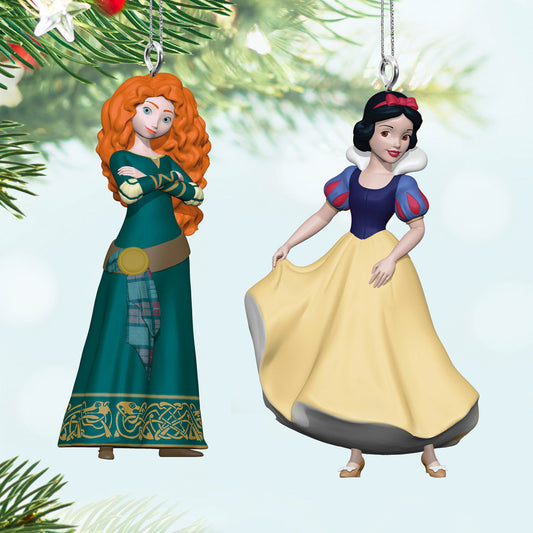 Disney Princess, Merida and Snow White Ornaments, Set of 2 (Miniature) with detailed features and vibrant colours against a snowy background.