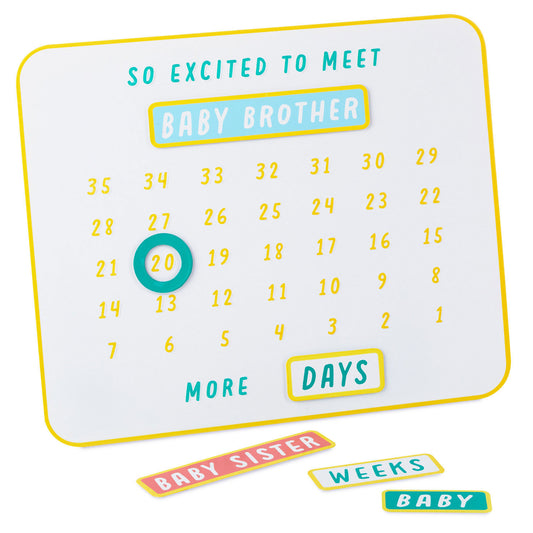 So excited to meet you magnetic baby countdown board featuring a white metal surface, colourful magnets and a circular marker for tracking days.