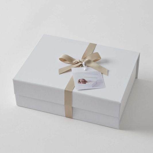 Taupe Bunny Hamper Gift Set gift wrapped in a white box with a gold ribbon and a gift tag, showcasing an elegant appearance.