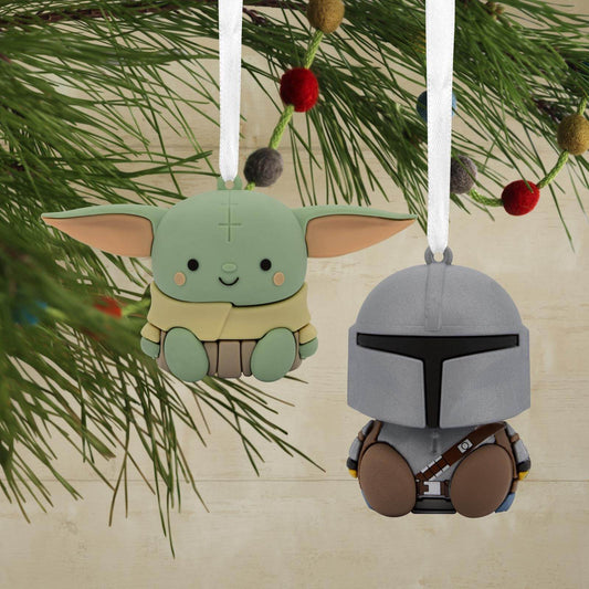 Better Together Star Wars™: The Mandalorian™ and Grogu™ Magnetic, set of 2 ornaments hanging on tree branches with festive decorations.