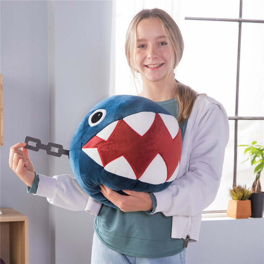 Nintendo Super Mario Chain Chomp Mega Mocchi Mocchi plush held by a girl, showcasing the soft, rounded design and vibrant colours.