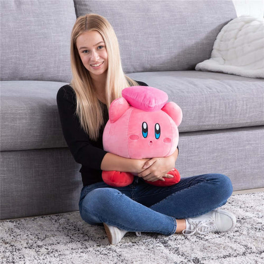 Kirby Heart Mega Mocchi Mocchi plush, large size, in a girl's lap, showcasing its soft texture and adorable design.