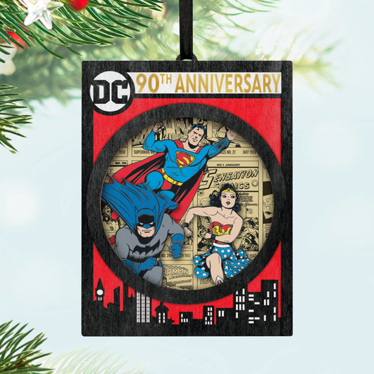 DC™ Comics 90th Anniversary — 2025 Hallmark Keepsake Christmas Ornament featuring Superman, Batman, and Wonder Woman in a detailed papercraft design.