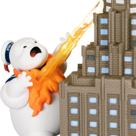 Ghostbusters Roast Him! With Light and Sound — 2026 Hallmark Keepsake Christmas Ornament features Stay Puft emitting flames at a skyscraper.