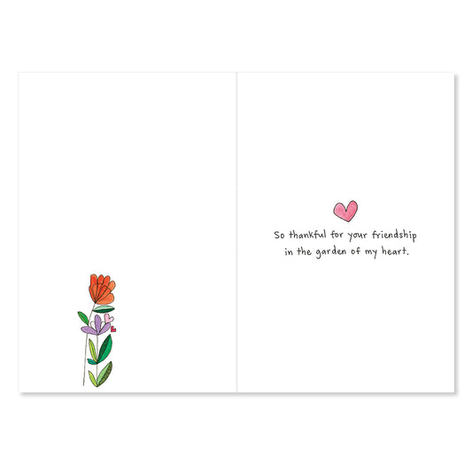 Greeting card with flowers and a heart on a white background