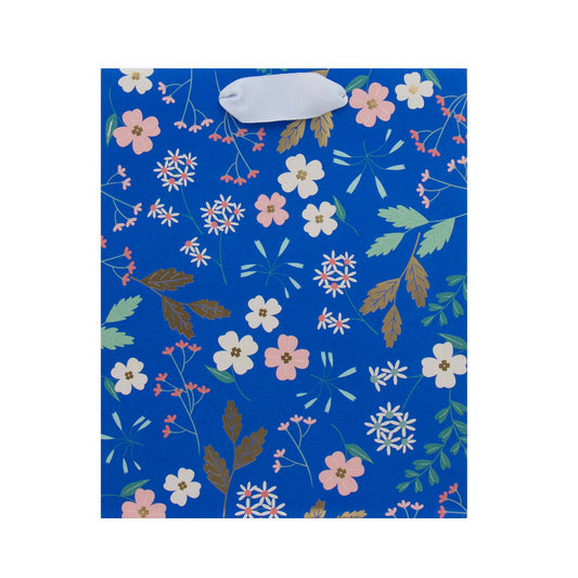 Hallmark Medium Gift Bag - Sky Blue Floral with floral design, featuring a white ribbed handle, in flat lay view.