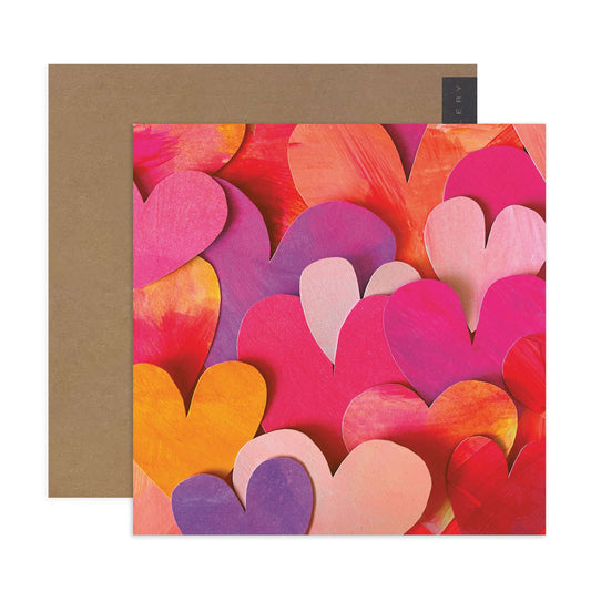 Hallmark x Kasey Rainbow Gallery Blank Greeting Card - A Lotta Love featuring a vibrant heart pattern in pink, red and purple tones with a brown kraft envelope.