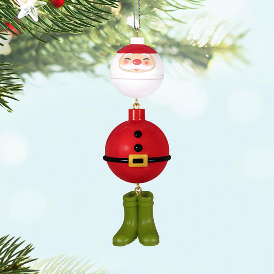Hooked On Santa, Fishing — 2025 Hallmark Keepsake Christmas Ornament featuring Santa bobbers with green wading boots, hanging on a Christmas tree.