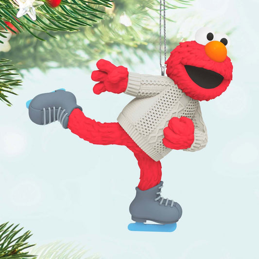 Sesame Street® Skating With Elmo — 2025 Hallmark Keepsake Christmas Ornament, red Elmo wearing a cable-knit sweater while ice-skating on a decorated Christmas tree.