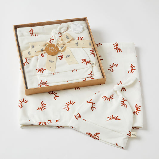 Sunset Jersey Baby Wrap & Knotted Beanie Set in gift packaging, featuring sun print design on soft cotton fabric.