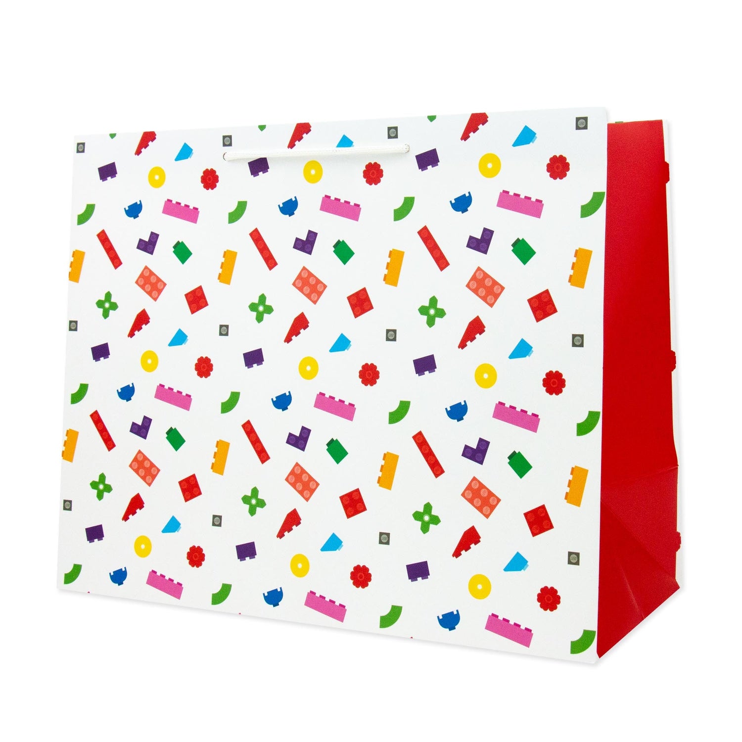 Hallmark Medium Gift Bag - Lego in bright colours with LEGO block patterns, featuring red sides and a flat lay view.