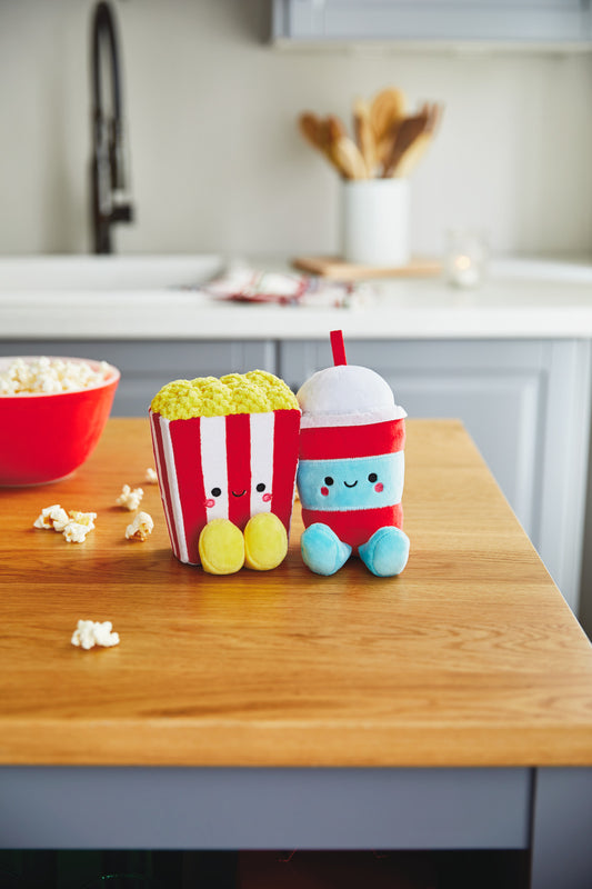 Popcorn and Slushie Magnetic Plush – Better Together, adorable plush food characters with embroidered details, on a wooden table