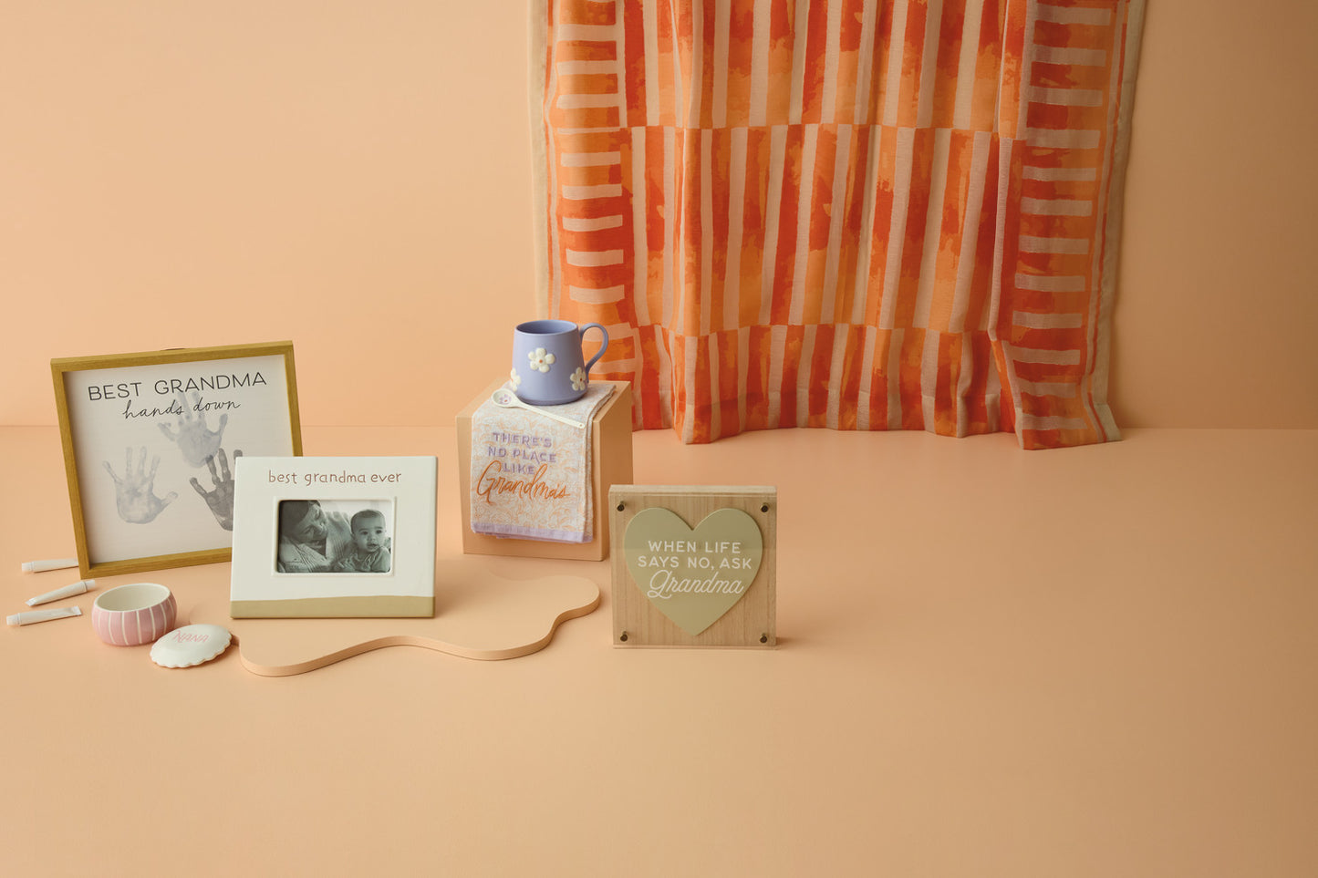 Best Grandma Ever Picture Frame, 4x6, displayed with decorative items on a peach background, capturing a warm, sentimental atmosphere.
