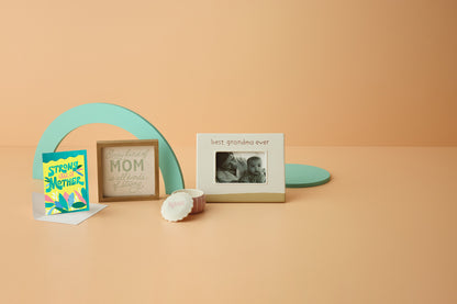 Best Grandma Ever Picture Frame, 4x6, ceramic, white and raw, angled view with decorative cards on a peach background.