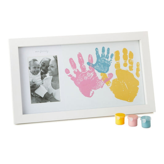 Family handprint and photo frame kit with a white frame, colourful handprints, and three paint pots for DIY art.