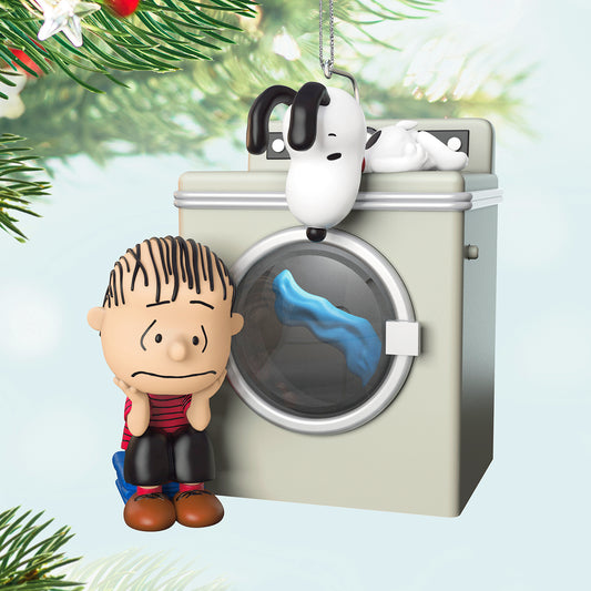 The Peanuts Gang Waiting Game With Light and Motion — 2026 Hallmark Keepsake Christmas Ornament featuring Linus and Snoopy next to a washing machine.