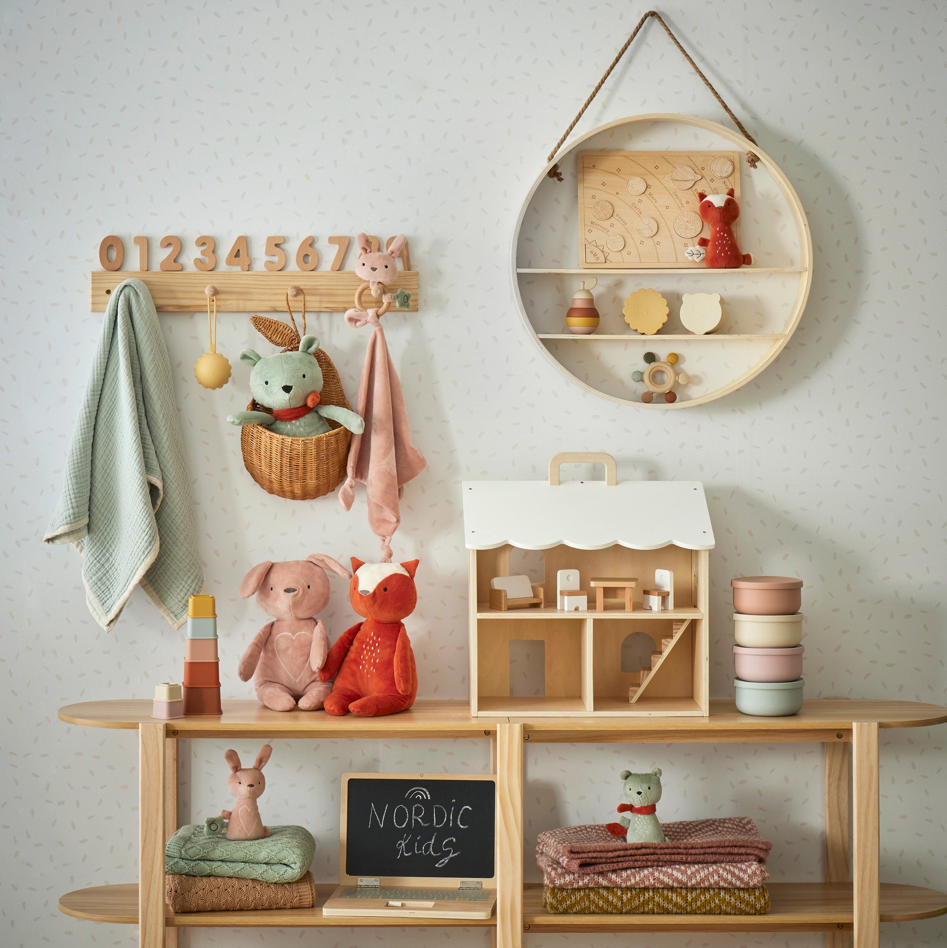 Freya Plush Bunny Rattle featured in a children's playroom with toys, decorative items, and a pastel colour scheme.