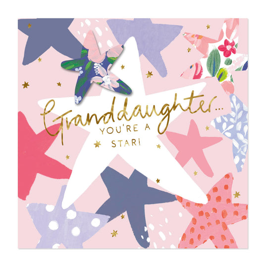 A square greeting card with a pink background and a collage of colorful starfish illustrations. A large white star in the center has the words 'Granddaughter.