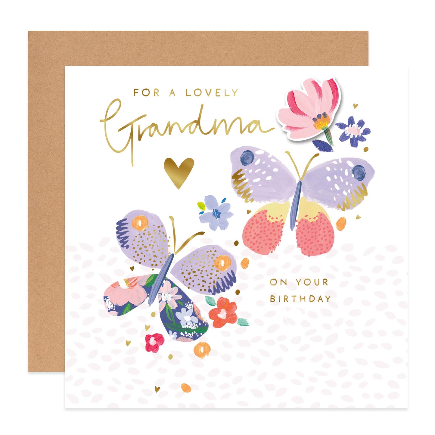 A square greeting card with a kraft envelope behind it. The card reads 'FOR A LOVELY Grandma ON YOUR BIRTHDAY' in gold lettering, with two illustrated butterflies and small flowers in pastel colors on a white background.