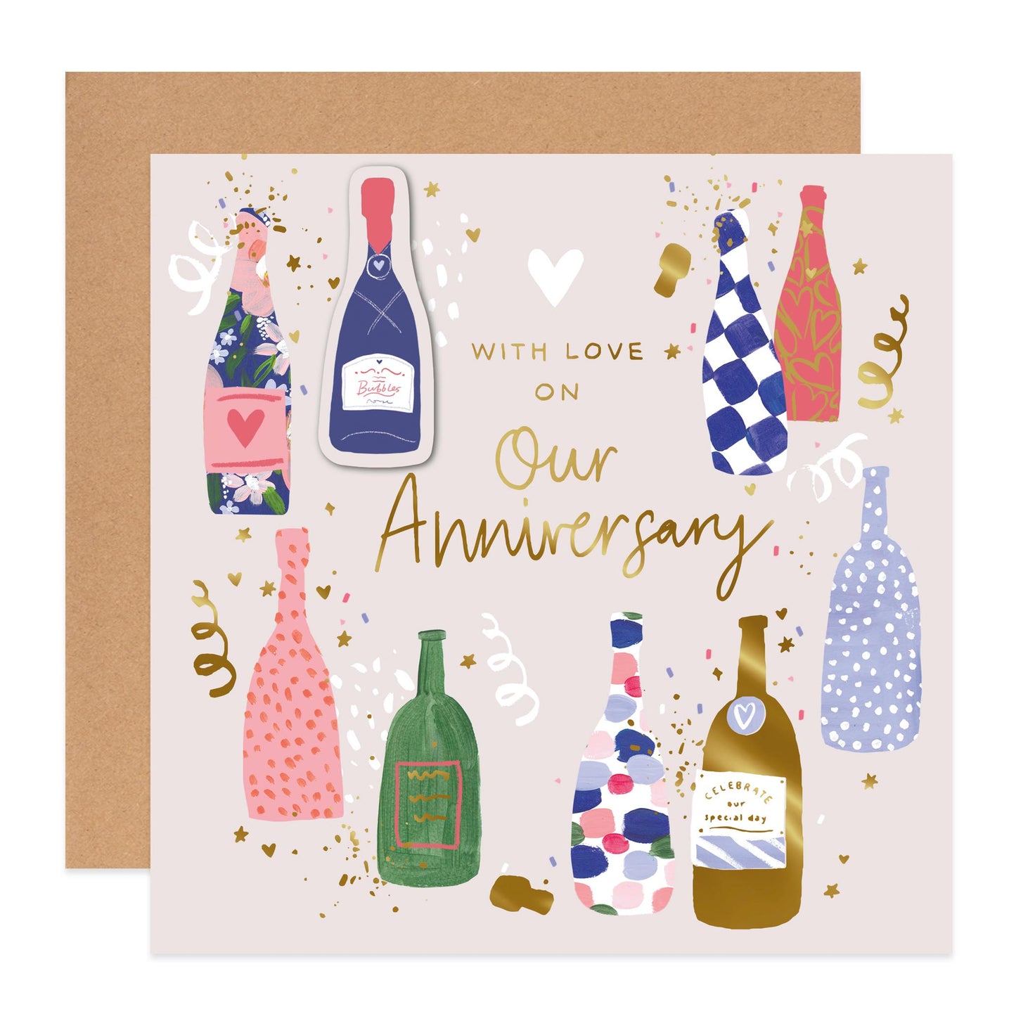 An anniversary greeting card with a kraft envelope behind it. The card has a light blush background and features illustrated champagne bottles in various colorful patterns, gold confetti, and the text 'WITH LOVE ON Our Anniversary' in gold script.