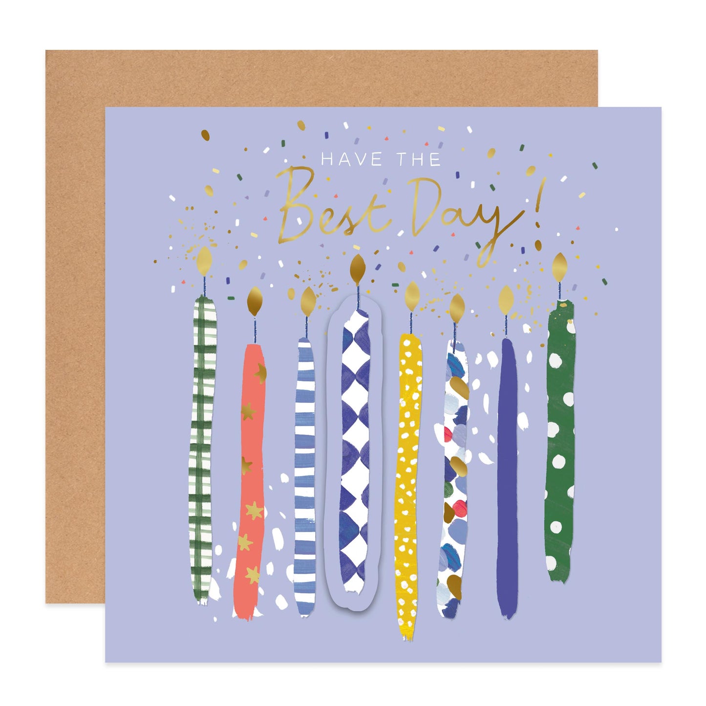 A square birthday card with a lavender background, gold script text reading 'HAVE THE Best Day!', and nine colorful illustrated candles in different patterns. A plain brown envelope is partially visible behind the card on a white background.