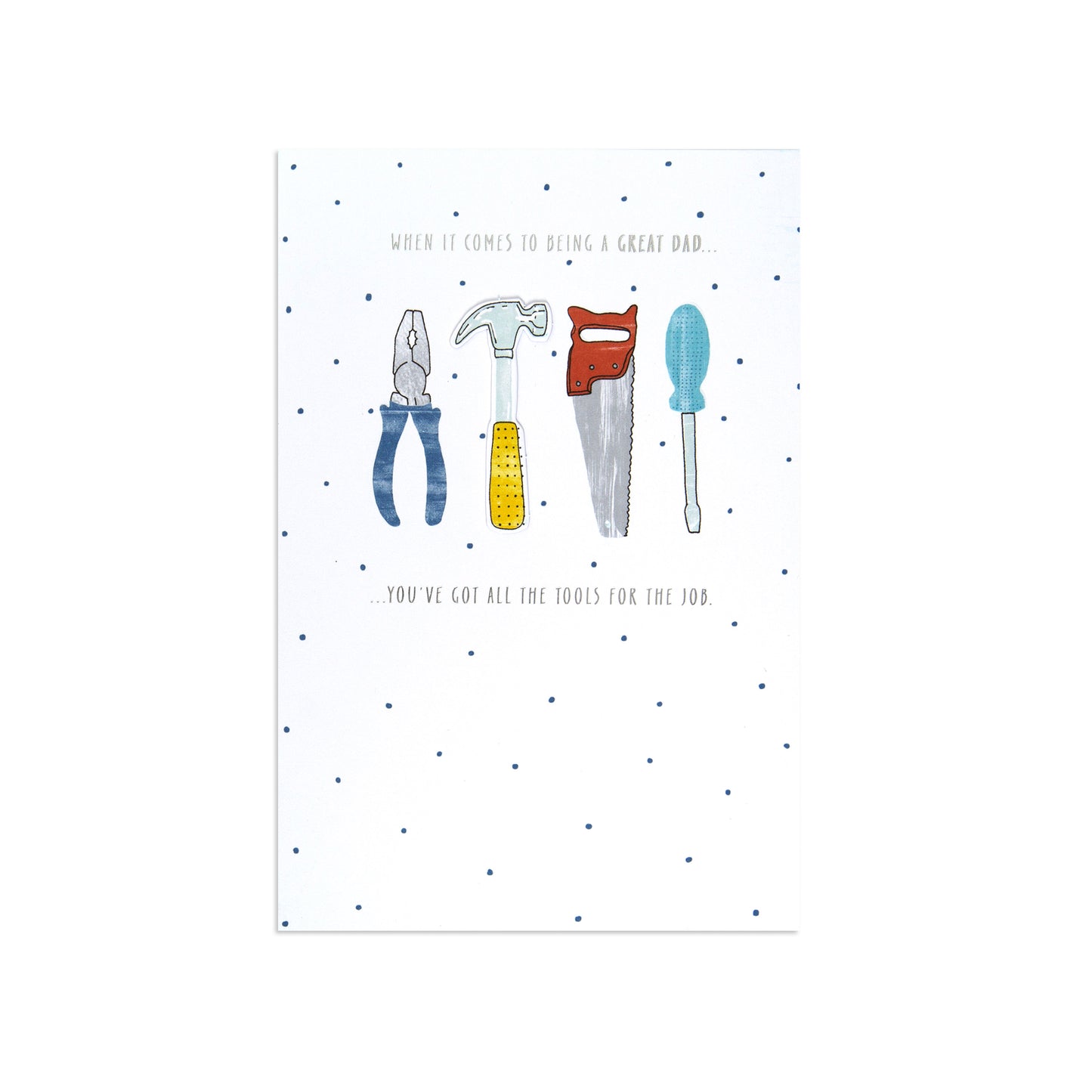 A white greeting card with a dotted pattern and an illustration of four hand tools—a pliers, hammer, saw, and screwdriver—centered on the front. Small printed text appears above and below the tool illustration.