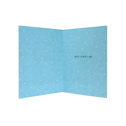 An open light blue Father's Day greeting card with a white polka dot pattern and the text 'HAPPY FATHER'S DAY' printed on the right panel.
