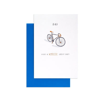 Hallmark Father's Day Card - Wheelie Great featuring a bicycle illustration and message on a white card with a blue envelope.