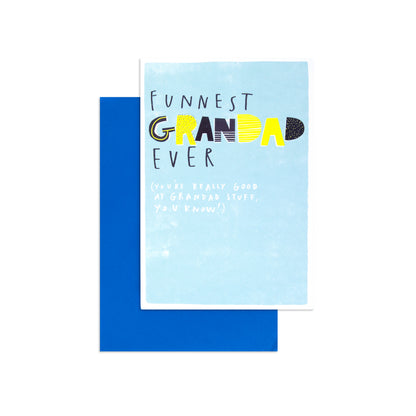 Fcc Grandad Funniest card design features bold text on a blue background, with a matching blue envelope, perfect for gifting.