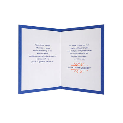 An open folded greeting card with a blue border, white interior pages, and printed Father's Day messages, shown on a plain white background.