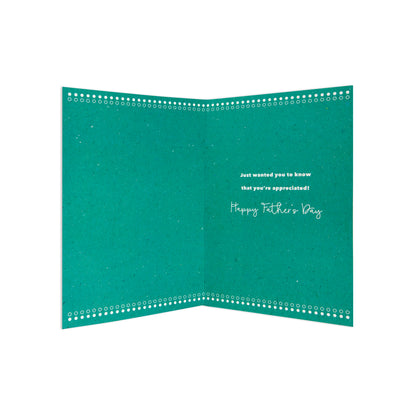 An open teal Father's Day greeting card with white decorative dotted borders along the inner flaps and the text 'Just wanted you to know that you're appreciated! Happy Father's Day' on a white background.