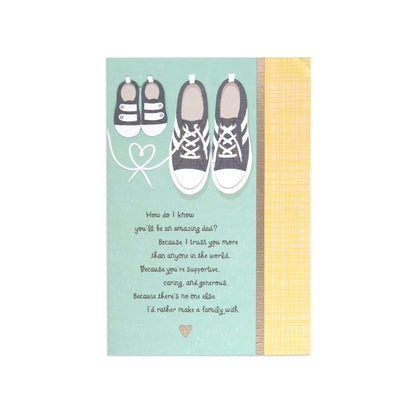 Fcc New Dad Shoes greeting card featuring illustrated sneakers and baby shoes with a heartfelt message on a teal background.