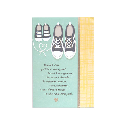 Fcc New Dad Shoes greeting card featuring illustrated sneakers and baby shoes with a heartfelt message on a teal background.
