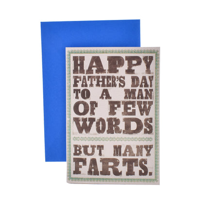 Hallmark Father's Day Card - Few Words, Many Farts with humorous message on front and blue envelope in flat lay view.