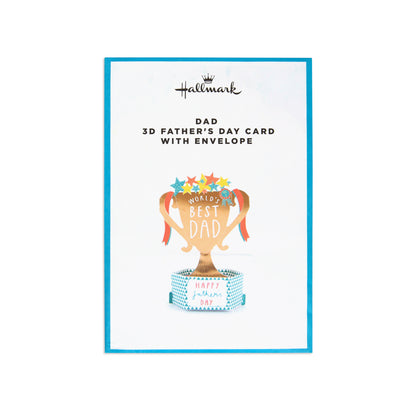 Hallmark 3D Father's Day card with envelope, featuring a gold trophy illustration with colorful stars and the words 'World's Best Dad' on a white card with a blue border.