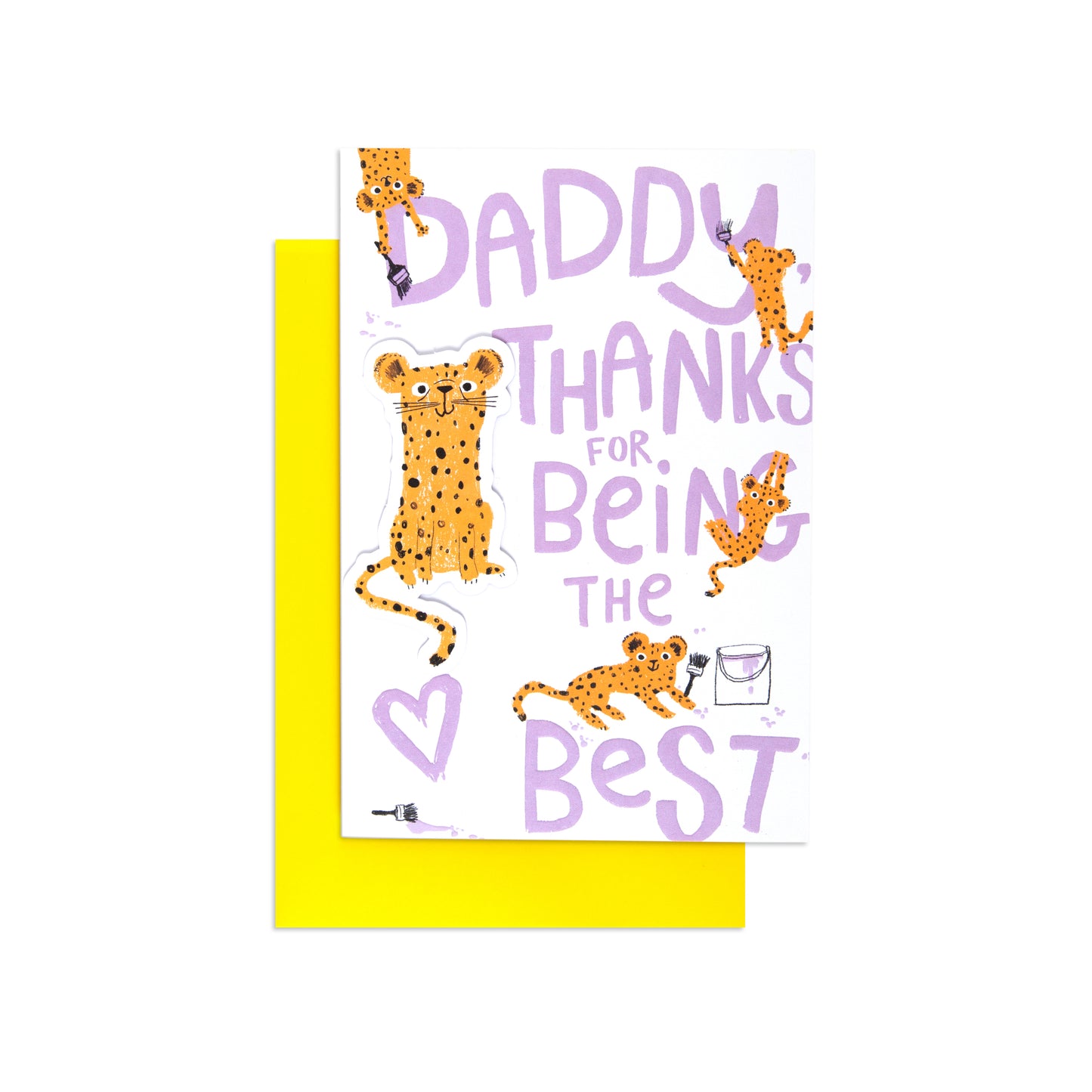 A greeting card with a bright yellow envelope behind it, featuring playful cheetah illustrations and the text 'DADDY THANKS FOR BEING THE BEST' in lavender lettering on a white card.