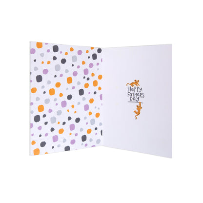 An open Father's Day greeting card with a white interior. The left panel features a pattern of scattered orange, purple, gray, and light blue dots on a white background.