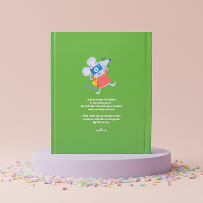 Green book with a cartoon mouse on a pink background